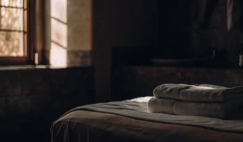 Clean, fluffy comforter on a made bed.