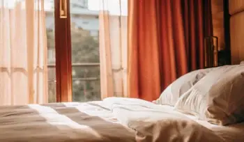 Clean bedding on a made bed.