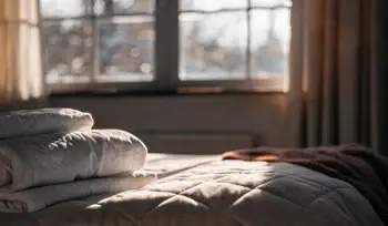 Clean comforter on a made bed.