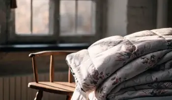 Clean, fluffy comforter on a chair.