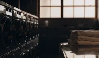 Clean, folded towels in industrial laundry facility.