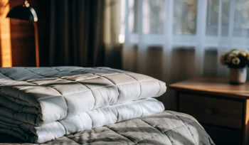 Clean, fluffy comforter on a made bed.