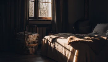 Clean comforter on a neatly made bed.