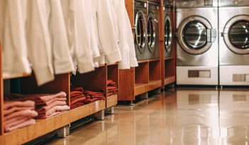Clean, folded linens in a medical laundry facility in Woodbury.