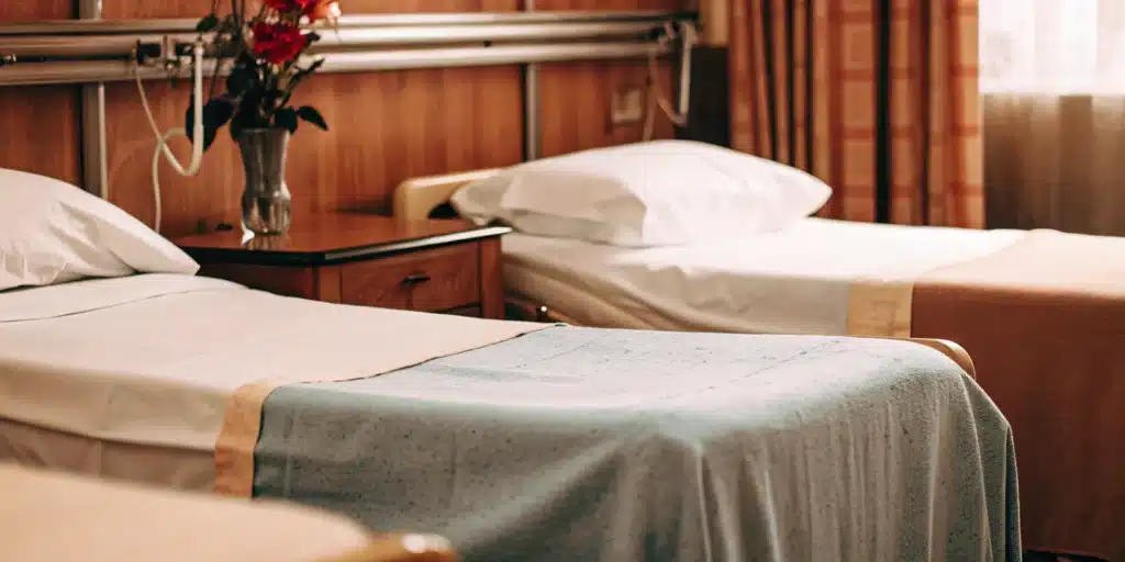 Clean hospital beds with crisp white linens at Albertsons.