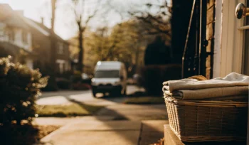A laundry basket on a doorstep from the best laundry pickup and delivery service in East Norwich.