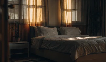 A professionally cleaned comforter on a bed in a Rockville Centre bedroom.