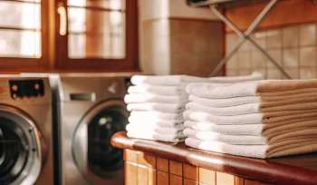 Old Brookville medical laundry service with stacks of sanitized patient towels.