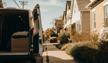 Laundry pickup van offering convenient service to homes in Carle Place.