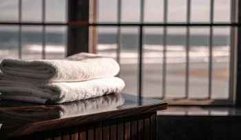 Clean, folded towels delivered by a commercial towel laundry service in Centre Island.