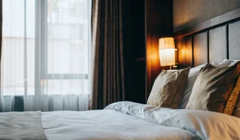 A perfectly clean comforter on a bed after professional cleaning in Old Brookville.