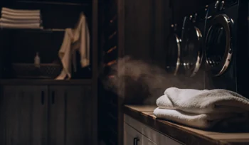 Folded comforter on a counter, ready for professional cleaning service in Mill Neck.