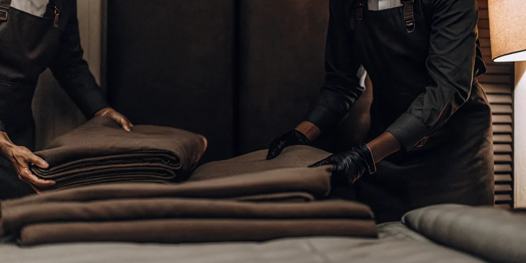 A crisp, clean comforter being folded by a professional cleaning service in Hicksville.