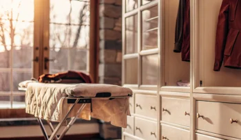 A comforter ready for professional cleaning in a bright Old Westbury laundry room.