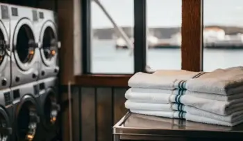 Sanitized medical linens and industrial washers at a laundry service in Cold Spring Harbor.