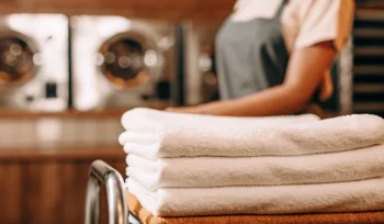 A cart of freshly laundered towels from a professional laundry service in Sea Cliff.