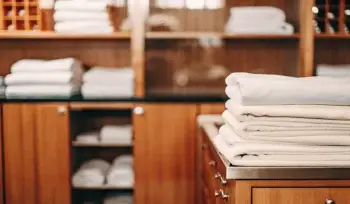 A stack of clean, folded healthcare linen for a medical facility in Commack.