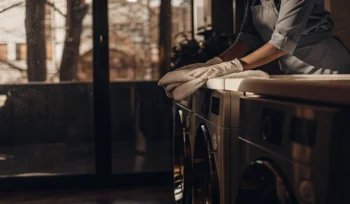 A professional folding a freshly cleaned comforter in Williston Park.