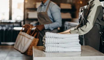 Professional wash and fold service in Freeport with stacks of clean laundry.