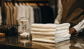 A stack of clean, folded towels from a wash and fold service in Oceanside.