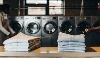 Stacks of folded laundry from a professional laundry service in Baldwin.