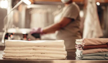Clean, folded medical linens and uniforms from a professional laundry service in Bellmore.