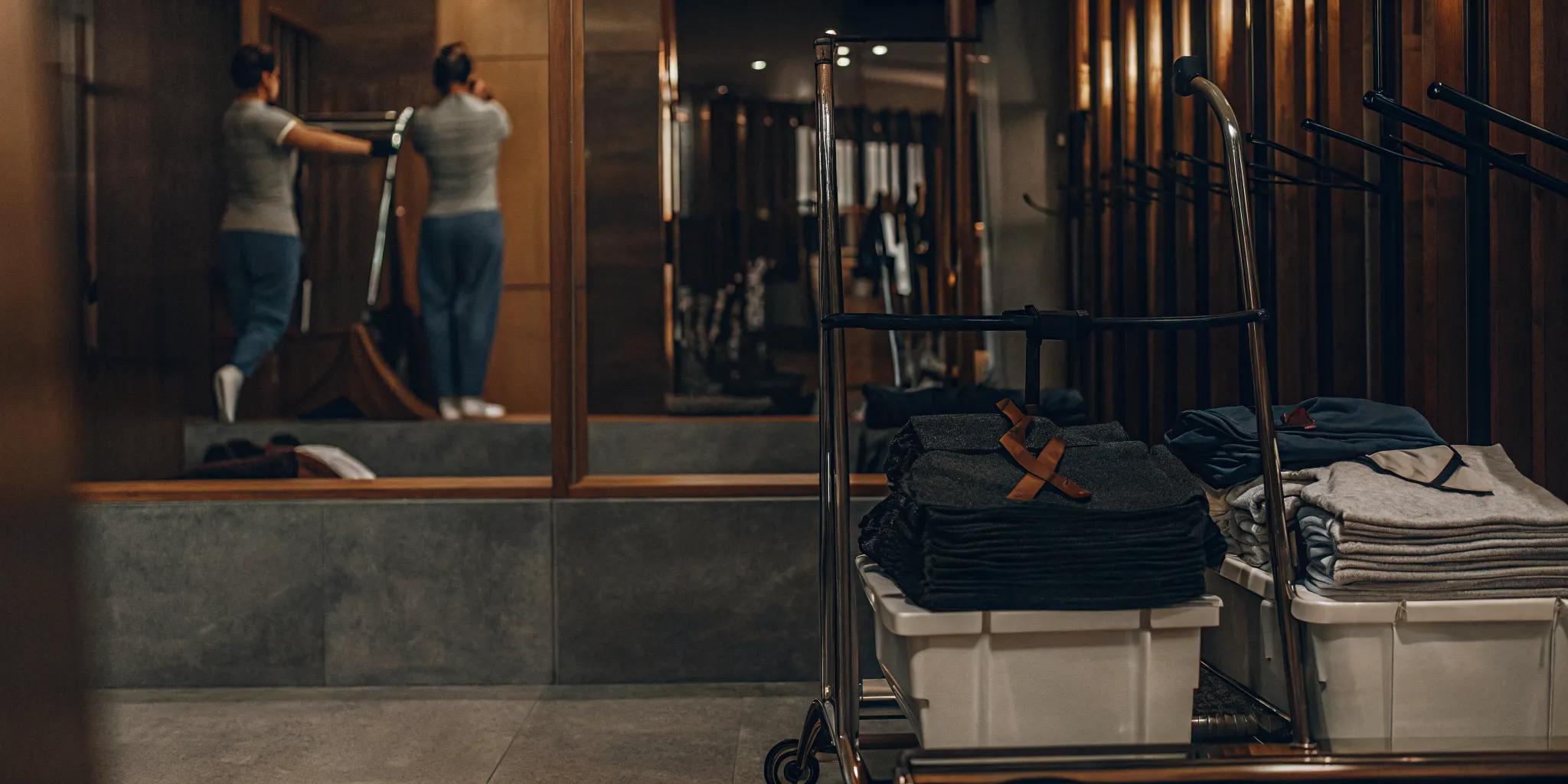 Freshly folded athletic wear and towels from a laundry service on Long Island.